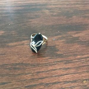 Black oval ring with gold color